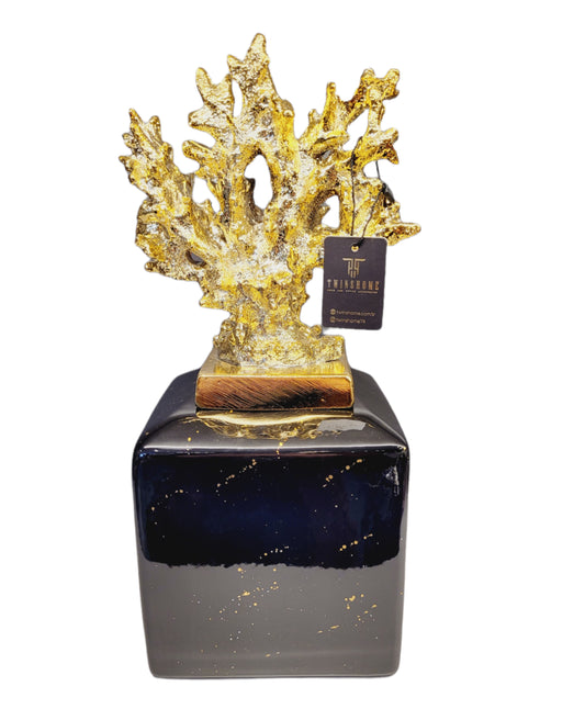 Black Cube with a Golden Corall Statuette